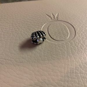 Authentic Pandora Seashell with pearl charm.